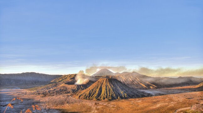 Sunrise, smoking Mount Bromo, Mt. Batok at front, Mt. Kursi at back, Mt. Gunung Semeru, Bromo Tengger Semeru National Park, Java, Indonesia