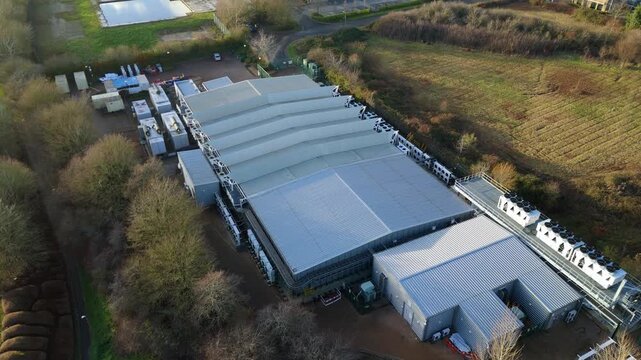 Drone view of modern Milton Keynes infrastructure built for AI technology and high-density server farm cooling.