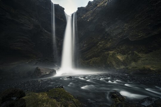 Waterfall Kvernufoss in a gorge, dramatic dark atmosphere, time exposure, near Sk&oacute;gafoss, Southurland, Iceland