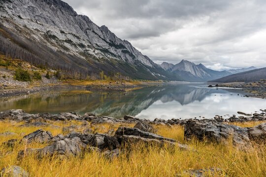 Mountains reflected in a lake, Medicine Lake, Maligne Valley, Jasper National Park, Alberta, Canada
