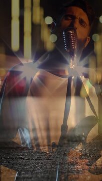 Vertical video: Headlights sparking overlay lead singer playing guitar and emoting at mic for music