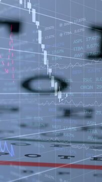 Vertical video: Fading overlay causing candlesticks over eye chart in studio, lens showing percents