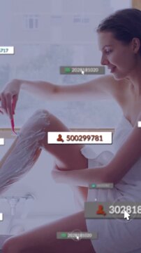 Vertical video: Shaving woman in towel raising leg in bath with foam and razor while overlays rise