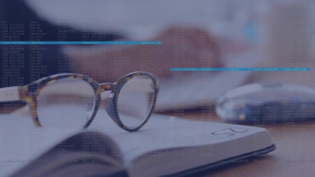 Animation of data processing against close up of glasses over open book on wooden table