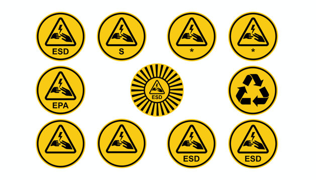 A collection of warning labels and eco-friendly symbols arranged on a surface