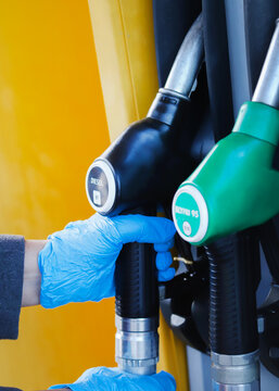 Hand holding a disel nozzle
