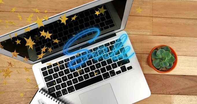 Laptop computer glowing neon sale banner moving across keys, featuring golden stars and succulent