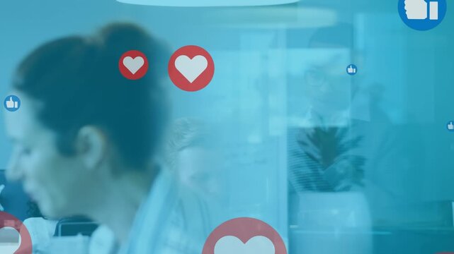 Animation of online icons over diverse business people