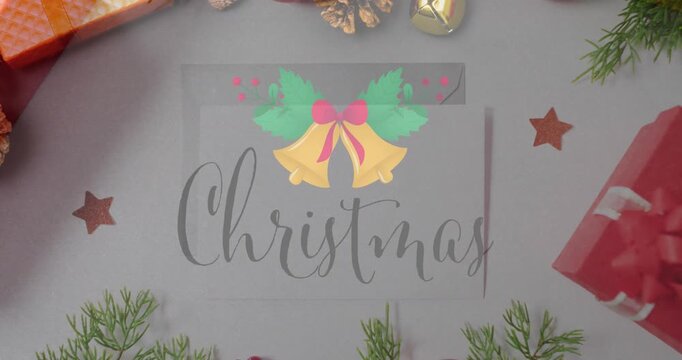 Animation of christmas greetings text over christmas presents and decorations