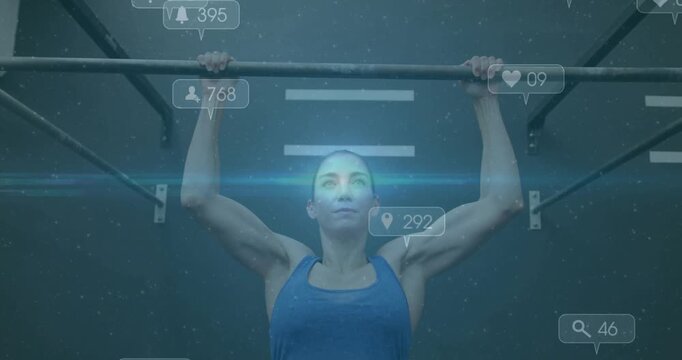 Female athlete gripping pull-up bar and pulling up, generating rising engagement metrics in fitness