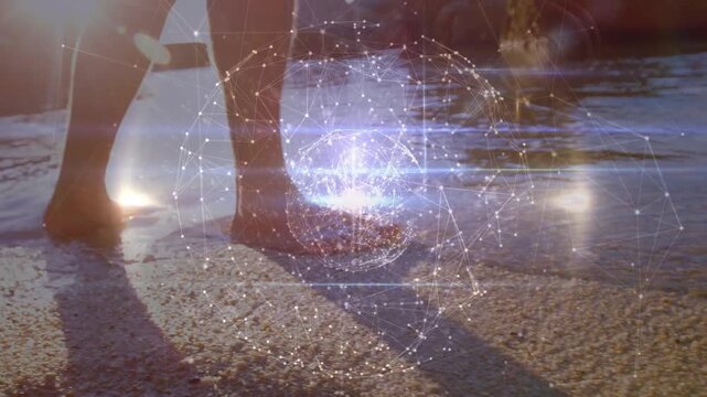 Animation of globe of connections over female teacher and schoolgirl writing