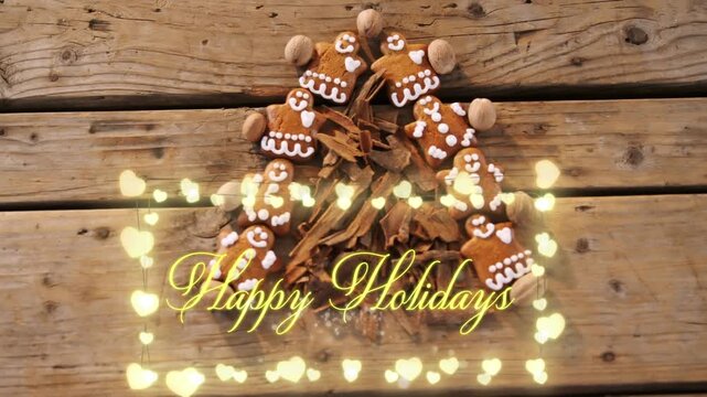 Overhead view of gingerbread cookies and cinnamon sticks forming christmas tree 4k
