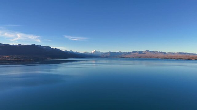 Mount Cook centered in blue Lake Pukaki on New Zealand South Island