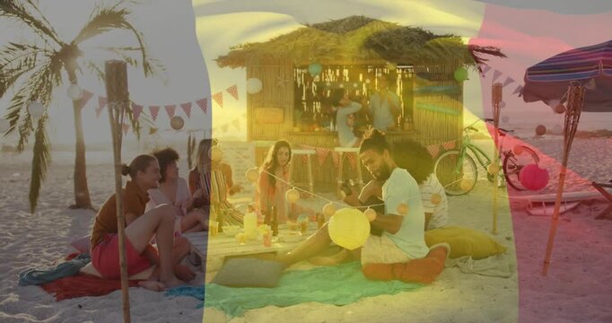 Dusk sparking beach party server pouring drinks man playing yellow balloon event flag overlay scene