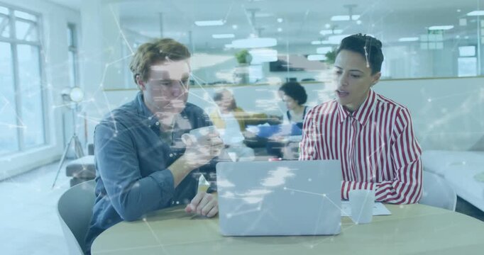 Man pointing at laptop, activating animated network overlay and guiding business analysis