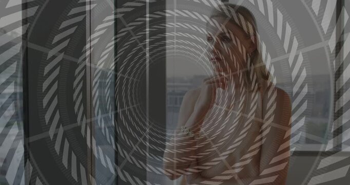 Woman at highrise window, seeing skyline and resting chin while spiral overlay rotating for design