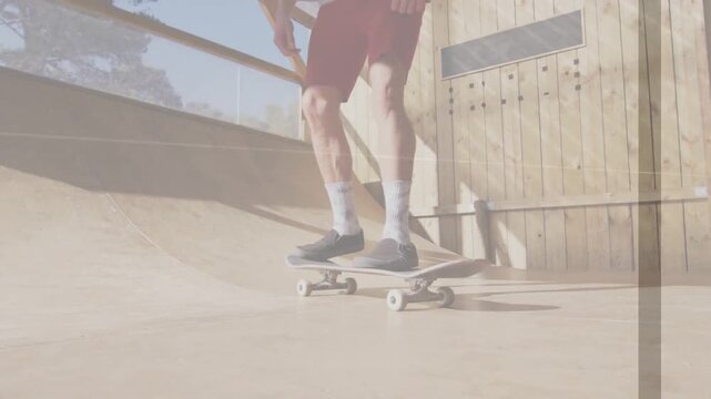 Sports skateboarder shifting weight, popping ollie on mini ramp, board lifting rotating to gain air