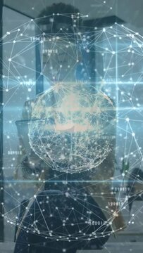 Vertical video: Woman holding phone in mirror testing tech AR globe rotating glowing hiding face