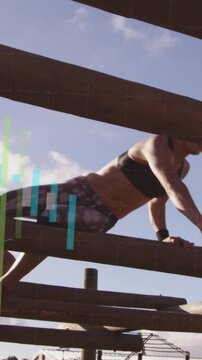 Vertical video: Woman shifting across beams into plank crawling in training as graphs overlay
