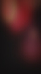 Fototapeta premium Deep red, grainy abstract background, with subtle light, spots grainy texture blurry light spots