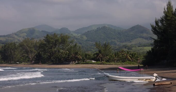Boats line the shore of Roca Partida Beach in Arroyo de Liza, Veracruz, Mexico.
