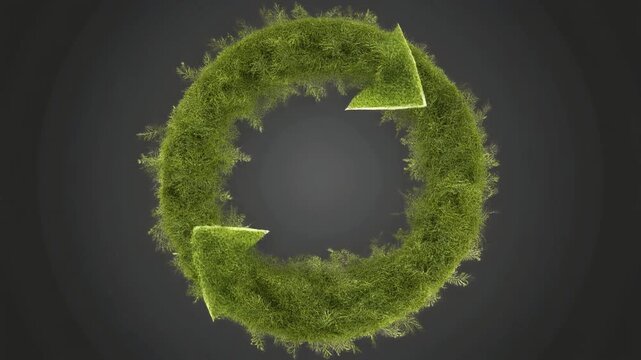Circular economy concept with green moss forming recycling arrows on a dark background