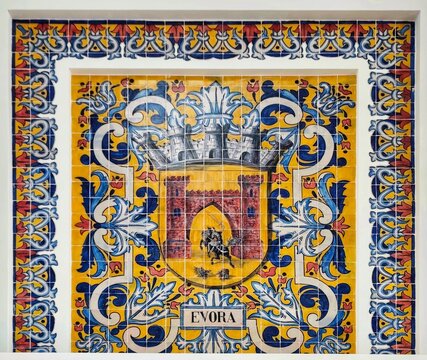 Photo of the municipal coat of arms of Evora, depicted in traditional polychrome Azulejo tiles inside the historic Sul e Sueste river terminal. 