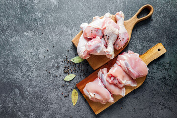 Freshly prepared chicken pieces ready for cooking in a cozy kitchen setting © muse studio