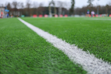 soccer field with green grass, white markings, and a corner flag.. The image captures part of the pitch used in professional matches, highlighting sports atmosphere and game preparation © Point of view