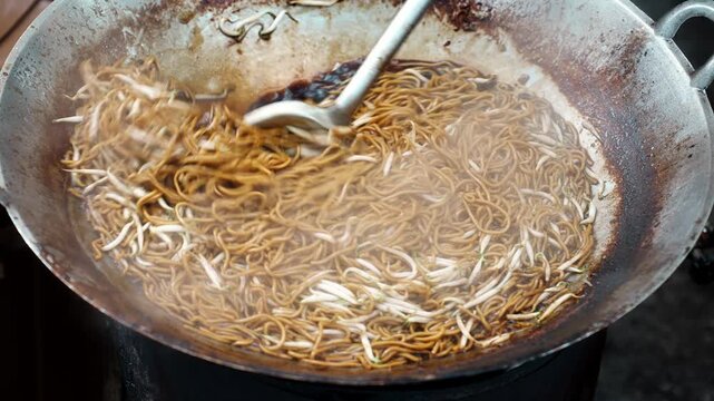 Street Vendor Stir Frying Mee Sotong Noodles In Wok
