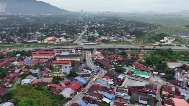Aerial drone view of kubang semang town and highway