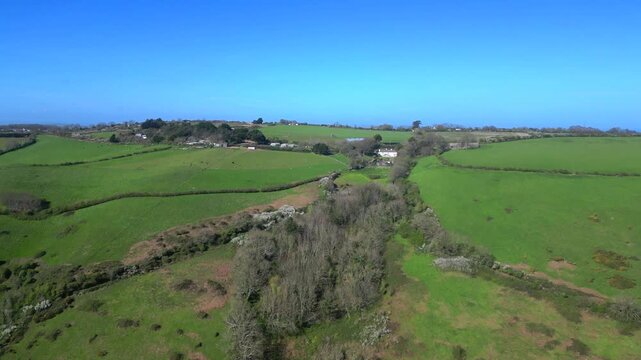 Woodhuish, South Devon, England: DRONE VIEWS: The drone rises over farmland to reveal the fishing port of Brixham and Torbay. Brixham is both a major UK fishing port and a popular tourist destination.