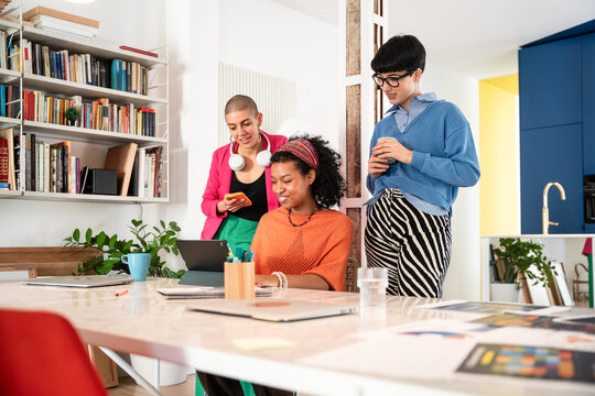 Women collaborating in a modern creative workspace
