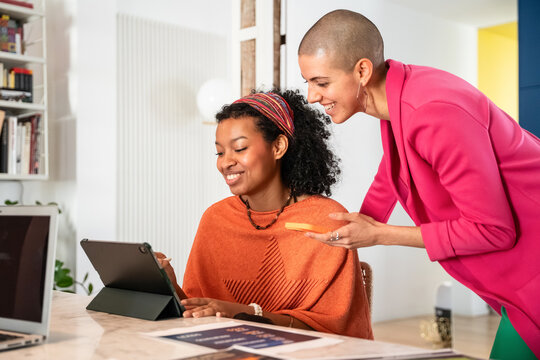 Creative businesswomen collaborating in modern office