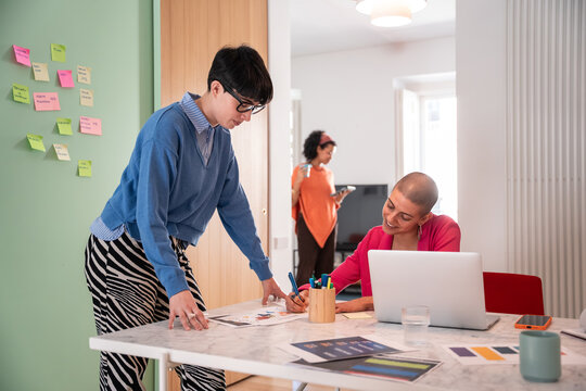 Creative women brainstorming in modern office setting