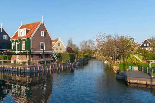 Amsterdam canal with traditional Dutch houses in spring