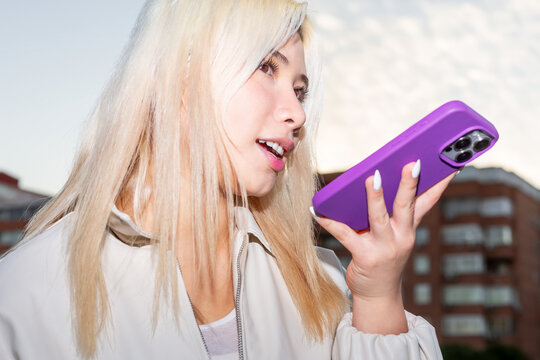 Urban Gen Z girl using smartphone with flash street style