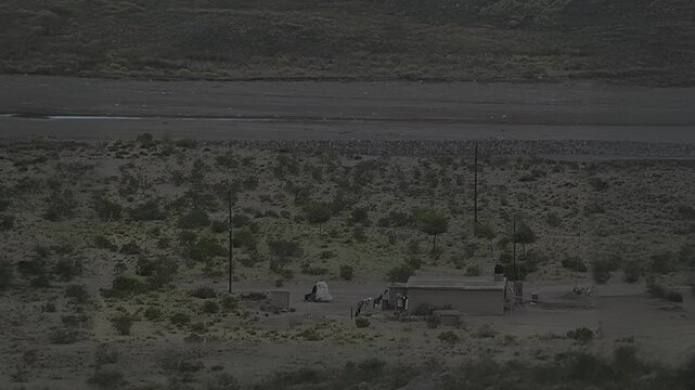 Remote Desert House in Vast Arid Landscape