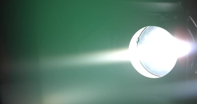 Technician Finetunes Bright LED In Sleek Futuristic Laboratory Amidst Mist And Reflective Apparatus