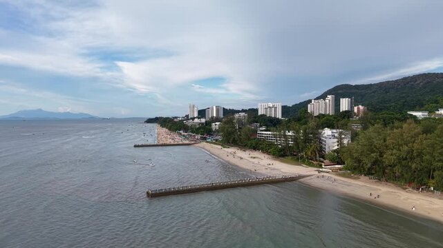 Aerial view of Outfall Sungai Batu Ferringhi in Penang shows coastal outfall structure extending into turquoise waters