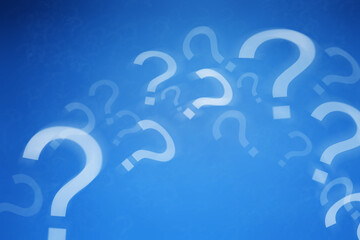 Many question marks flying against blue background © New Africa