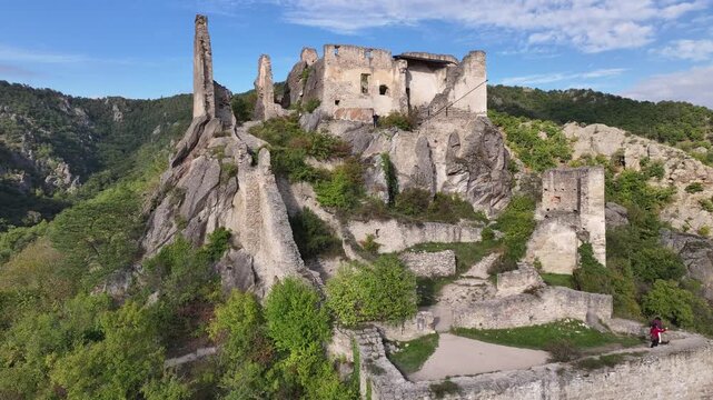 Drone aerial of Burgruine Durnstein castle ruins above town.