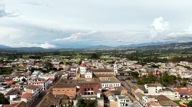 Cinematic Aerial View of Cotacachi with Central Cathedral and Andean Landscape