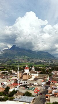 Cinematic Aerial View of Cotacachi with Central Cathedral and Andean Landscape