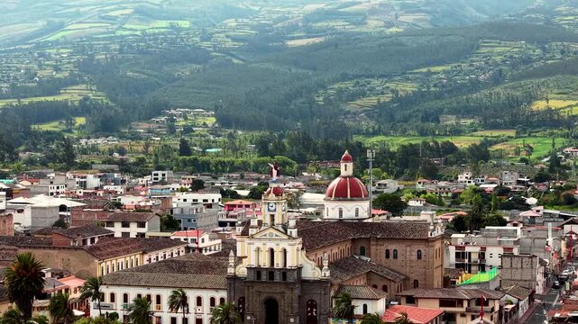 Cinematic Aerial View of Cotacachi with Central Cathedral and Andean Landscape