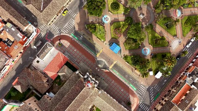 Cinematic Aerial View of Cotacachi with Central Cathedral and Andean Landscape