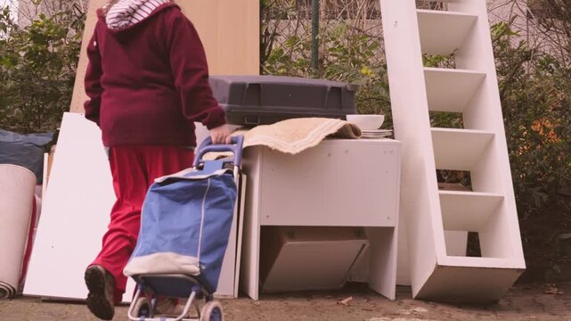 woman browsing old items bulky waste collection point, Second life old items versus consumerism, pile discarded furniture, reuse and recycling, sustainable living, mindful consumption, waste reduction