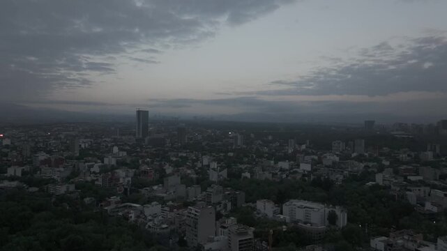 Thought process
Thought process
Title: Aerial view flying backward over the Condesa neighborhood in Mexico City at sunrise, tree-lined streets and rooftops under a moody cloudy dawn sky