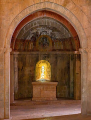 Le Thoronet Abbey interior chapel, Provence-Alpes-Côte d’Azur, France, 6 April 2026: Romanesque apse with altar and illuminated window