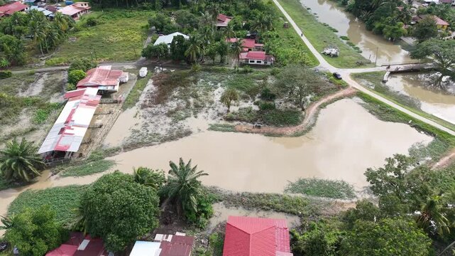 Aerial drone view Labuh Banting green riverside village wetlands